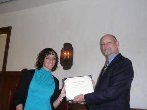dr. louis martin giving award to student
