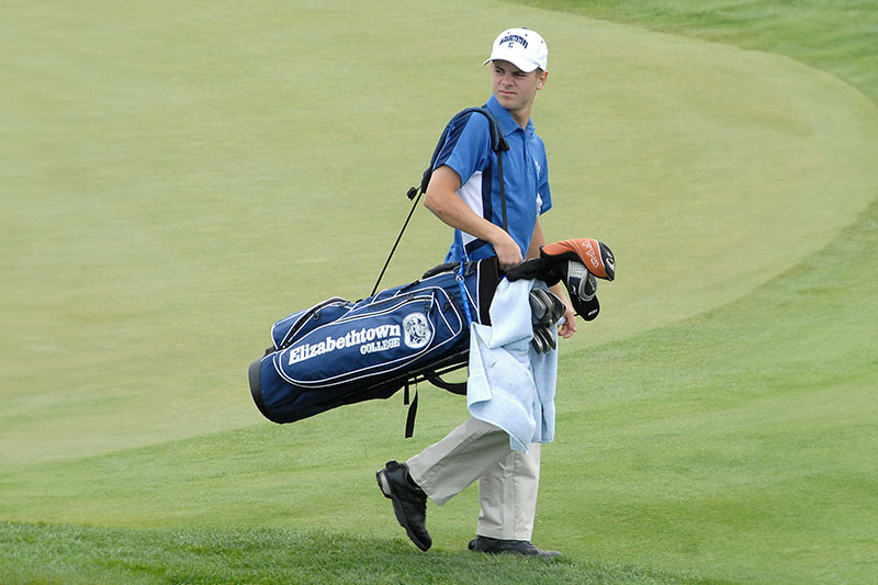 carrying golf bag