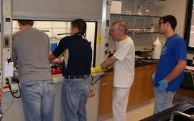 Dr. Rood and Dr. Schaeffer work with students in the research lab