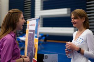Student talking with recruiter at job fair