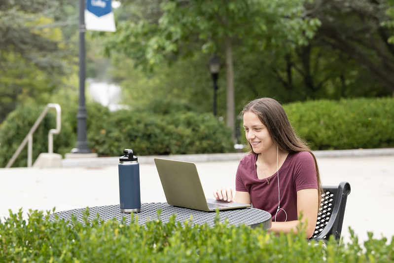 student sitting on computer