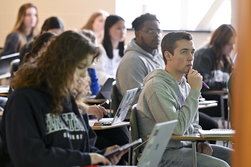 student working with faculty